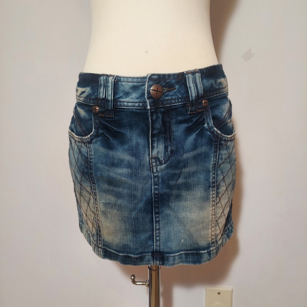 Distressed denim mini skirt